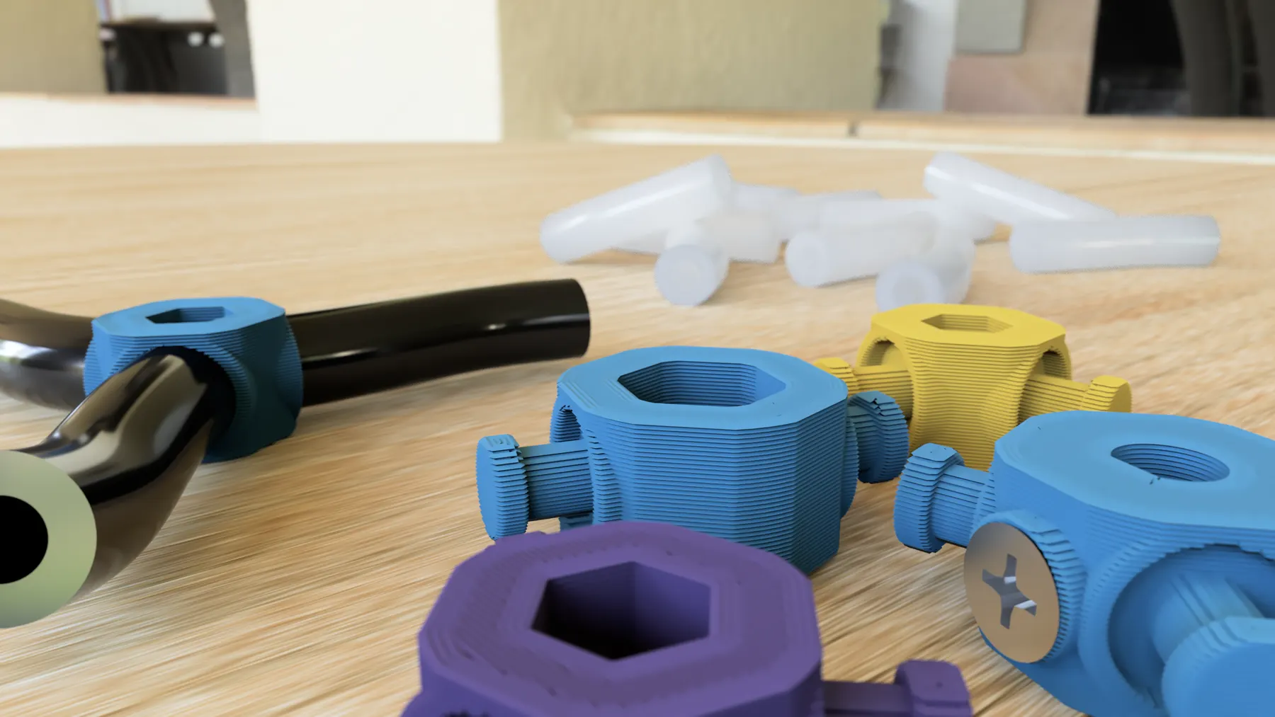 Printed opTake hubs in several colors and axle sizes, with black and clear surgical tubing
